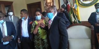 Benson Mutura fist bumps Nairobi Woman Representative Esther Passaris