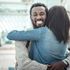 Man hugging woman