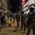 Ugandan police officers and members of Local Defence Units on curfew patrol in Kamapla in April 2020.