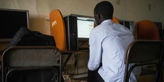 A man uses a computer at in Kampala, Uganda in January 2021.