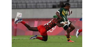 Kenya's Willy Ambaka (left) tackles South Africa's Branco du Preez