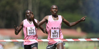Rhonex Kipruto (right) crosses the line to win the men's 10km race ahead of Michael Kibet