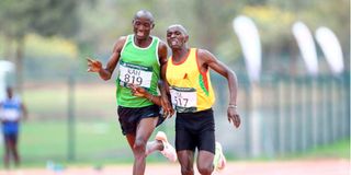 Charles Simotwo (left) and Daniel Munguti go head to head in 1,500m race