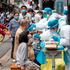 Medical workers take swab samples from residents to be tested for the COVID-19 coronavirus