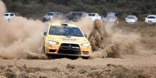 Carl Tundo navigated by Tim Jessop racing on a Mitsubishi Evo
