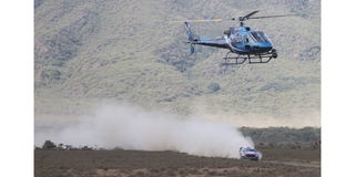 A helicopter patrols the route
