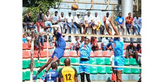 Linus Rotich of Nairobi Prisons spikes as TrailBlazers Jean Claude and Emanuel Melly block