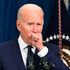 US President Joe Biden coughing