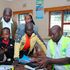 IEBC officials train the clerks on how to use the Kenya Integrated Elections Management System (KIEMS) kits.