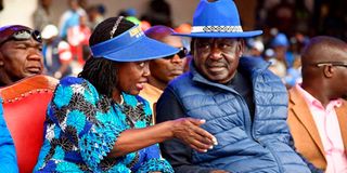 Azimio la Umoja running mate Martha Karua confers with presidential candidate Raila Odinga.