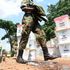 National Youth Service officer walking past ballot boxes containing ballot papers for Kanduyi constituency.