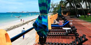 Tourists enjoy the sunshine at Bamburi Beach Hotel