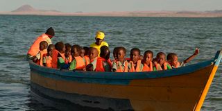 El-Molo Bay Primary School pupils take a boat to go to school