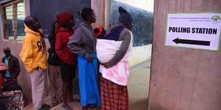 Voters queue to cast the ballots at Kacheliba Mixed Primary School