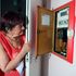 Pensioner Diane Skidmore examines her smart meter in London.