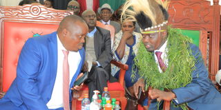 Outgoing Elgeyo Marakwet Governor Alex Tolgos (right) chatting with Governor Wisley Rotich