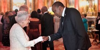 Queen Elizabeth II greets President Uhuru Kenyatta