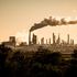 Smoke cloud rises from an oil petroleum refinery