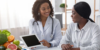 A doctor guides her patient through her diagnosis. Patients have rights that are enshrined in the Constitution of Kenya.