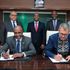 KCB Group PLC Chairman Andrew Wambari Kairu and Oliver Meisenberg, the Chief Executive Officer of Trust Merchant Bank.