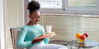A woman relaxes at home.