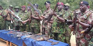 Rift Valley Regional Commissioner Maalim Mohamed (third right) displaying illegal guns recovered in Kerio Valley