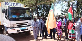 Trans Nzoia Health CEC Ms Claire Wanyama flagging off drugs and non-pharmaceuticals worth Sh51 million from Kemsa