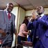 New ICT cabinet secretary Eliud Owalo receives documents from his predecessor Eliud Owalo