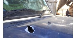 A police vehicle that was damaged as armed militia engaged police in a shootout