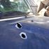 A police vehicle that was damaged as armed militia engaged police in a shootout 