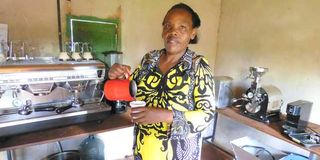 Josephine Wangui pours herself a cup of Kombucha coffee.