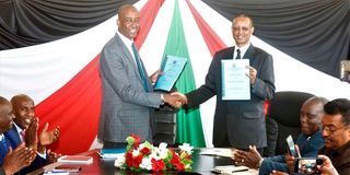 Rift Valley Regional Commissioner Dr Abdi Hassan and his predecessor Mr Maalim Mohammed