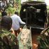 Police carry away bodies two children allegedly killed by their father