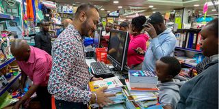 Parents and guardians buy books for their children at Savani’s Book Centre Limited in Nairobi
