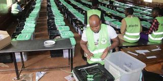 IEBC clerks sort polling material at Ng'araria Secondary School in Murang'a county