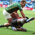 Kenya's Kevin Wekesa (right) scores a try past South Africa's James Murphy
