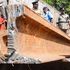 Police officers inspect scrap metal impounded from a smelting firm in Changamwe, Mombasa