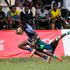 Brunson Madigu (left) of Strathmore Leos charges past KCB's Alex Mulwa