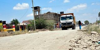 Motorists drive through the uncompleted section of Kimbo-Matangini Road