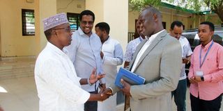 Nation Media Group Commercial General manager James Sogoti chats with Garissa speaker Abdi Idre