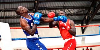 Lawrence Okuta (right) of Nairobi fights with Fredrick Okongo of MAB
