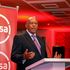 Absa Bank Kenya Chairman Charles Muchene speaking during the bank's 2022 full-year financial results investor briefing