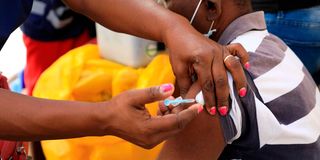 A medic administers a Covid-19 vaccine