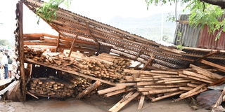 A timbre store that was brought down by heavy rains and floods at Ortum market