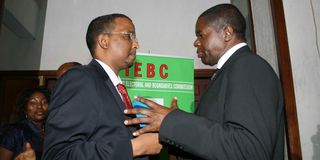 Former IEBC Chairman Ahmed Issack Hassan (left) with ex-IEBC CEO James Oswago