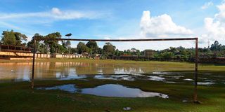 A flooded football pitch at Maua Stadium, Meru County