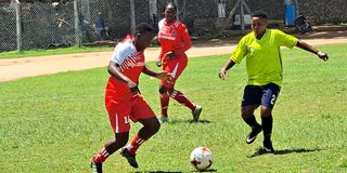 Kisumu All Starlets forward Beverline Adika (left) vies with Mombasa Olympic defender Celina Mwanyule