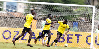 Tusker midfielder David Odoyo (centre) celebrates with teammates