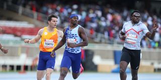 Aaron Brown (centre) of Canada