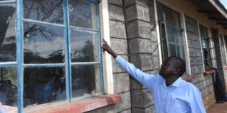 Kapindasum Primary School headteacher Elijah Kipton shows Nation.Africa a window with bullet holes on May 11, 2023